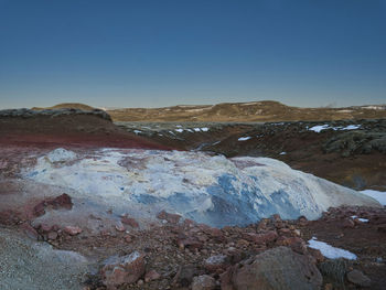 Scenic view of rocky mountains against clear blue sky