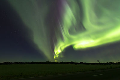 Scenic view of landscape against sky at night