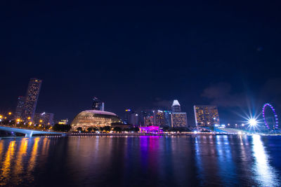 Illuminated city buildings at night