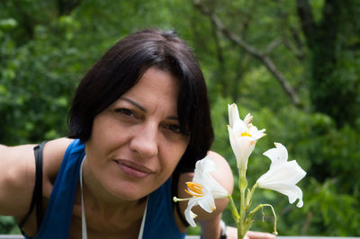 Portrait of woman with flower