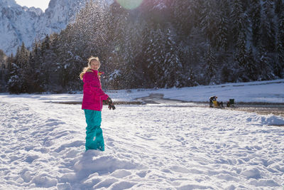 Rear view of woman in snow during winter