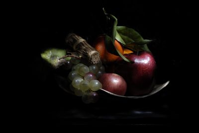 Close-up of fruits against black background