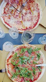 High angle view of pizza served on table