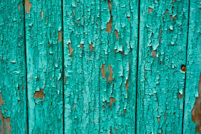 The texture of the painted wooden boards. background from old boards of green color. 