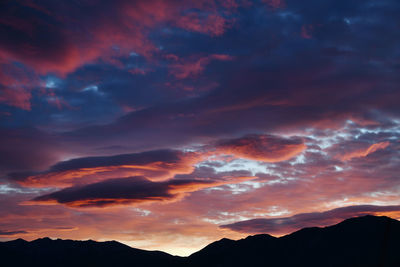 Low angle view of dramatic sky during sunset