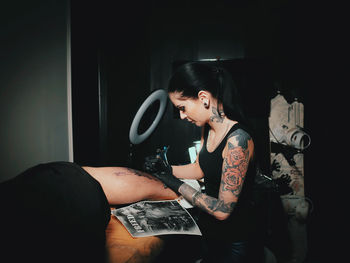 Young woman standing in mirror