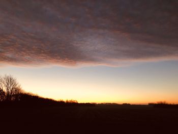 Scenic view of silhouette landscape against sky during sunset