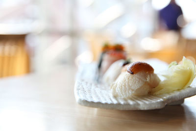 Close-up of bread in plate on table