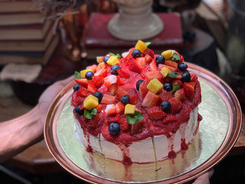 Close-up of hand holding ice cream