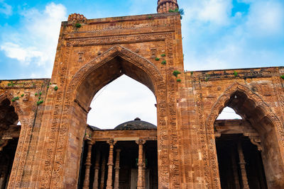 Ancient grand mosque called adhai din ka jhonpra vintage architecture with bright blue sky at day