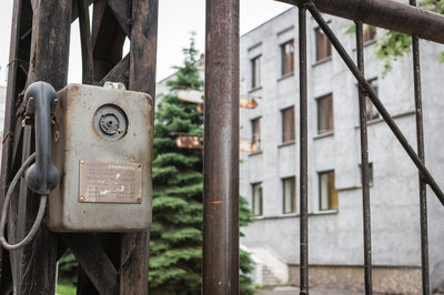 Close-up of an old pay phone outdoors