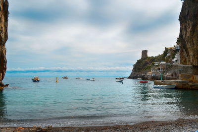 Scenic view of sea against cloudy sky