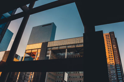 Low angle view of modern buildings against clear sky