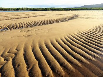Wave patterns on sand dunes at beach