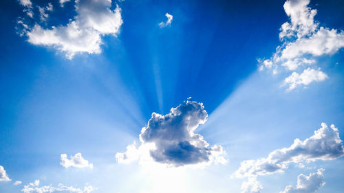 Low angle view of blue sky during sunny day