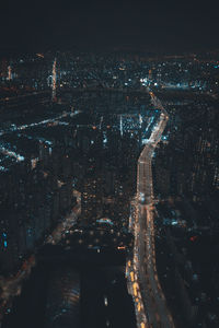 Aerial view of illuminated city buildings at night