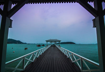 Pier over sea against sky