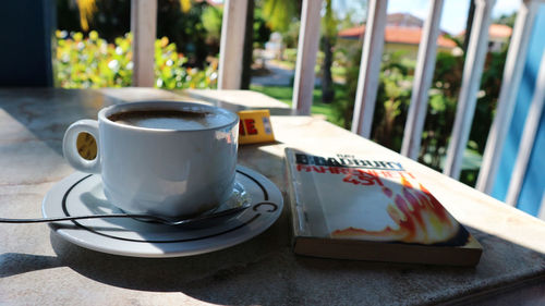 Close-up of coffee cup on table