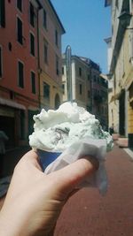 Cropped hand holding ice cream