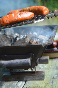 Close-up of sausages being grilled on barbecue