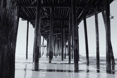 Full frame shot of below bridge over sea against sky