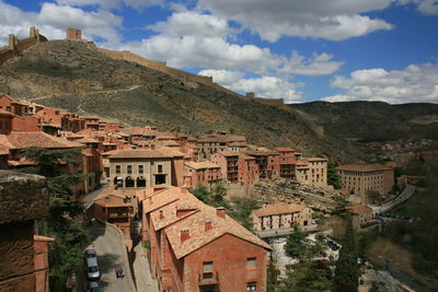 Buildings in town against sky