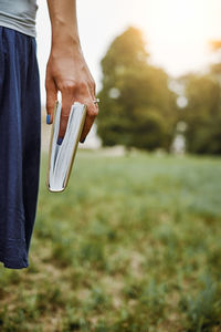 Cropped image of woman holding book