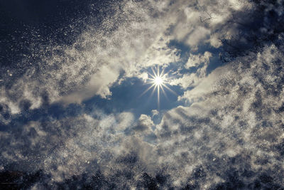 Sun shining through clouds