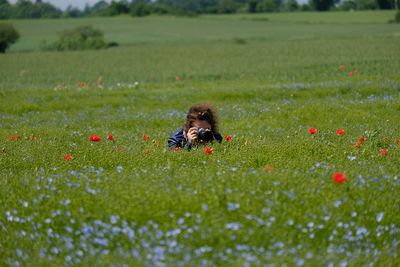 Woman photographing plants