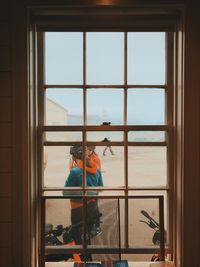 Reflection of people on glass window