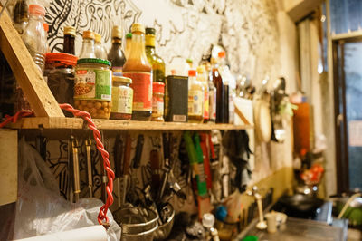 Bottles on shelves in kitchen