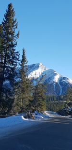 Scenic view of snowcapped mountains against clear sky
