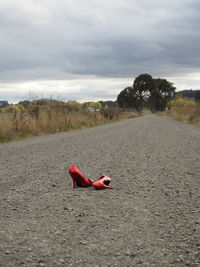 Low section of person lying on road