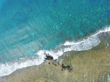 High angle view of waves on shore