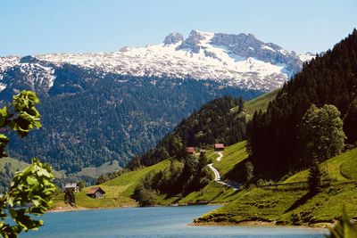 Scenic view of snowcapped mountains against clear sky