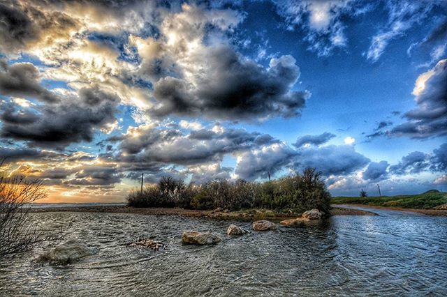 water, sky, cloud - sky, cloudy, tranquil scene, scenics, tranquility, waterfront, beauty in nature, cloud, nature, sea, rippled, idyllic, lake, river, overcast, weather, outdoors, no people