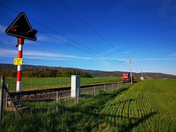 Train on field against sky