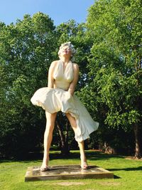 Full length of woman standing in park