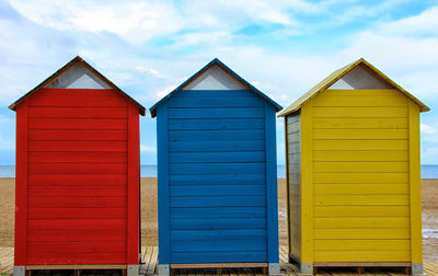 View of beach hut against sky