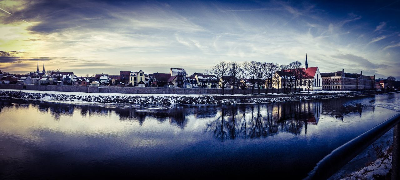 building exterior, water, architecture, sky, reflection, built structure, city, river, cloud - sky, outdoors, waterfront, nature, cityscape, no people, day, harbor, beauty in nature, urban skyline, skyscraper