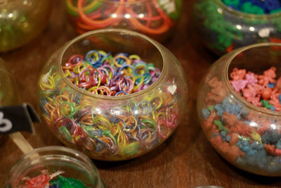 High angle view of candies in glass jar on table