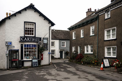 Street amidst buildings against sky