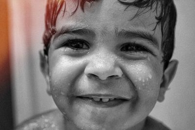 Close-up portrait of smiling boy