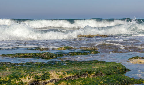 Waves splashing on rocks