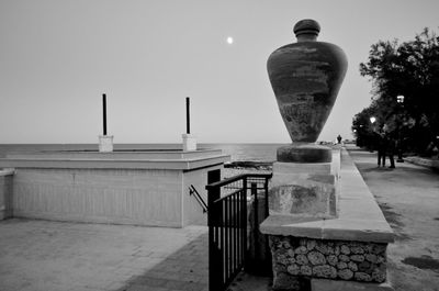 Rear view of illuminated street light against clear sky