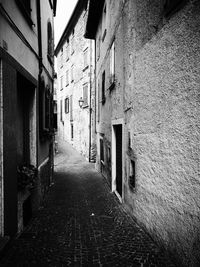 Narrow alley amidst buildings in town