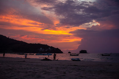 Scenic view of beach against sky during sunset