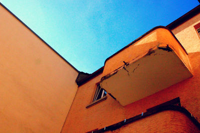 Low angle view of building against blue sky