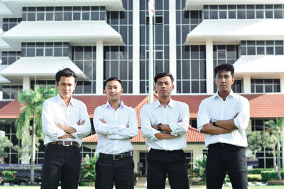 Group of people against buildings