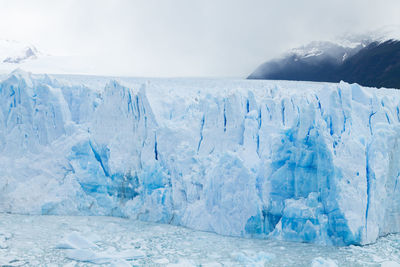 Scenic view of frozen sea against sky